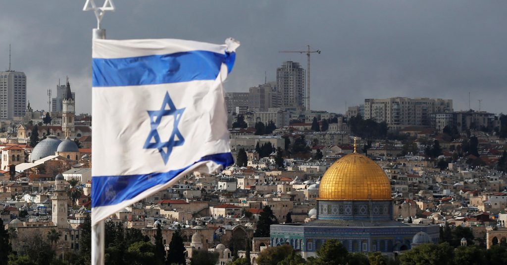 An Israeli Flag Is Seen Near The Dome Of The Rock, Located In Jerusalem's Old City On The Compound Known To Muslims As Noble Sanctuary And To Jews As Temple Mount