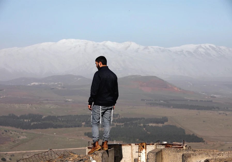 A man stands at Mount Bental, an observation post on the Golan Heights that overlooks the Syrian side of the Quneitra crossing, on January 21. (photo: REUTERS)