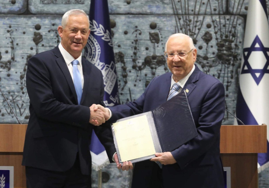 Over to you: Israeli President Reuven Rivlin (right) gives Benny Gantz a mandate to form a government