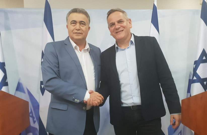 Labor leader Amir Peretz and Meretz Leader Nitzan Horowitz celebrate their election pact.