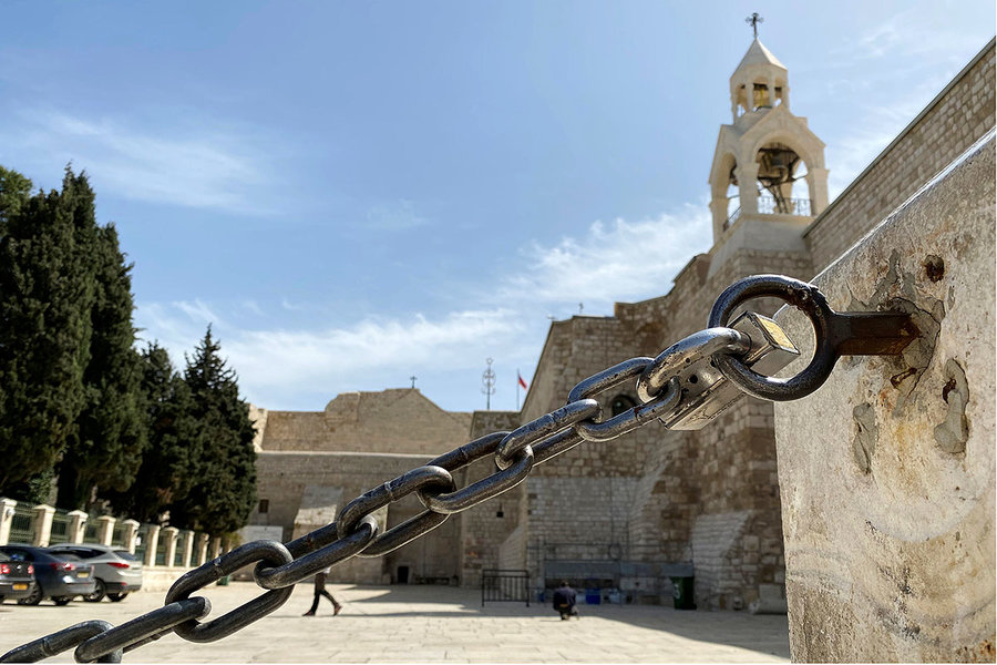 An entrance to the Church of the Nativity is seen locked amid coronavirus precautions Bethlehem, March 11, 2020. (Mustafa Ganeyeh/Reuters). 