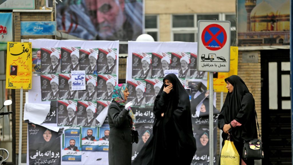 Electoral posters and a banner featuring Qasem Soleimani in Tehran. Photo: Atta Kenare/AFP via Getty Images