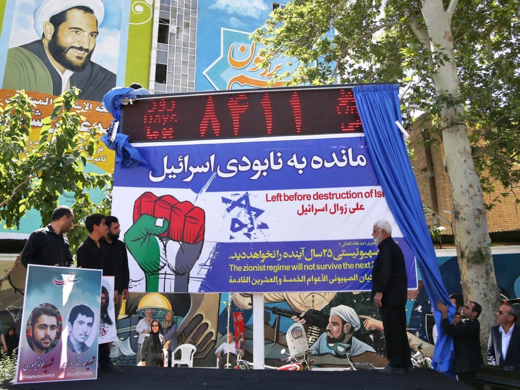 Iranian Protesters unveil a digital countdown showing 8411 days until Israel is destroyed (AP Photo/Ebrahim Noroozi)
