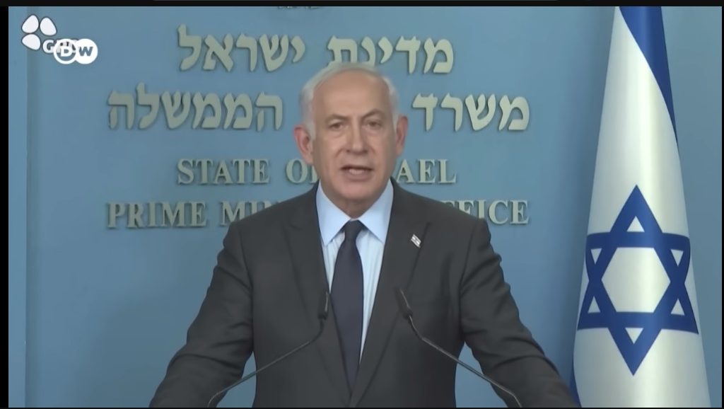 Israeli PM Binyamin Netanyahu announces a pause in his Government's judicial reform plans in a televised address on Monday, March 27  (Image: Youtube screenshot)
