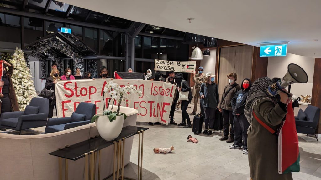 Pro-Palestinian protestors waiting in the lobby for the Israeli families of those murdered or taken hostage by Hamas