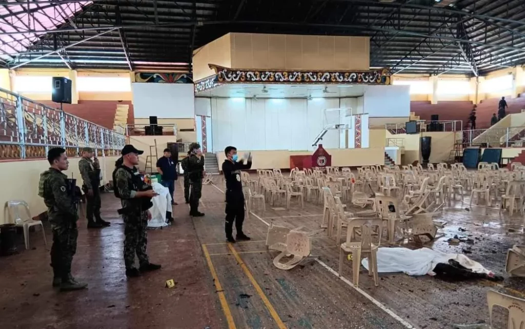 Authorities at the site of a Catholic Mass that a powerful explosion disrupted in Marawi City (Image: Rappler)