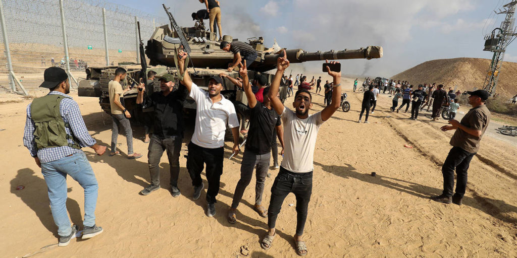 Palestinians celebrating the capture of an Israeli tank on October 7 – a symbol of Israel’s shattered security doctrine for Gaza (Image: X/ Twitter)