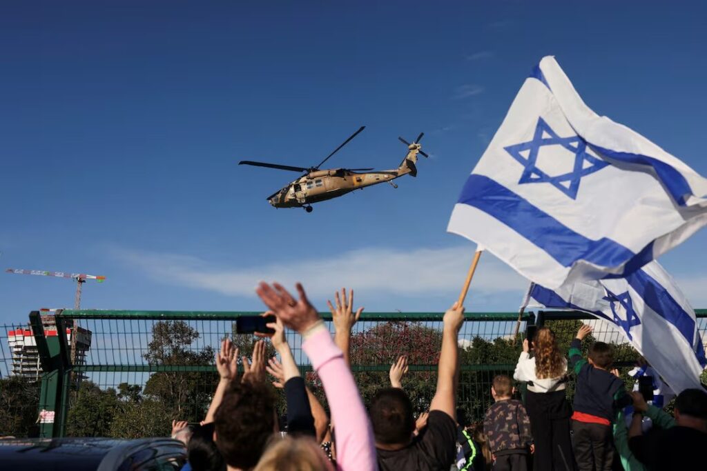 An Israeli helicopter bearing released hostages prepares to land (Image: X)