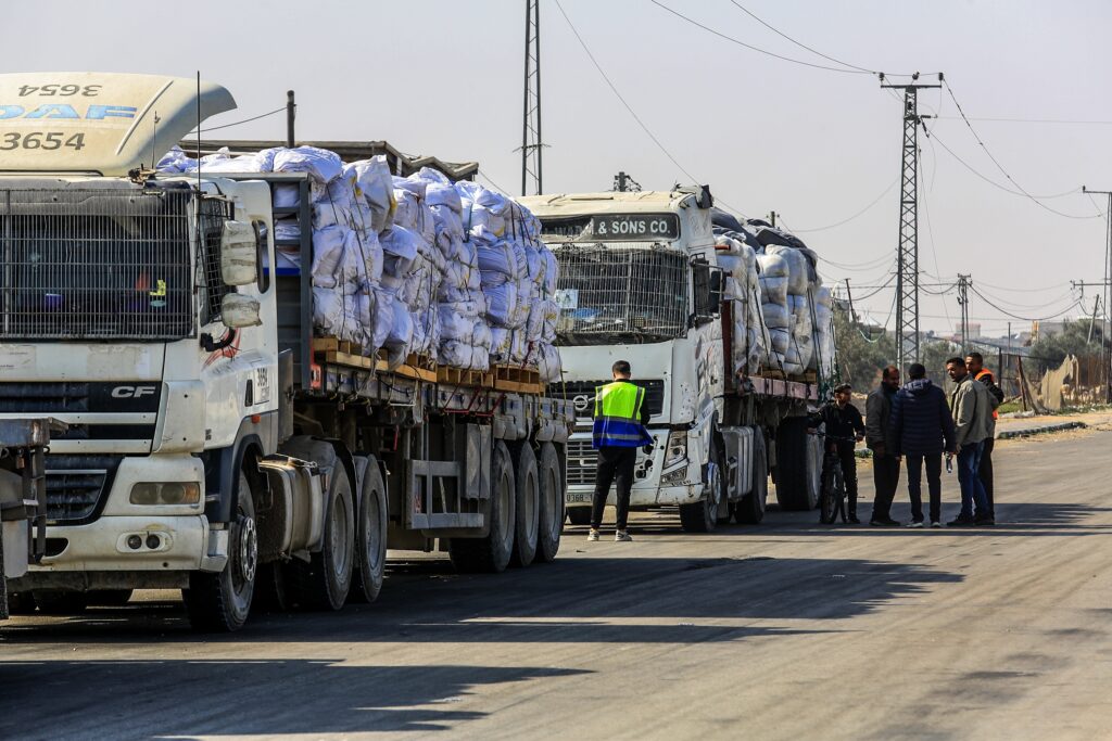 Palestinian,Trucks,Loaded,With,Humanitarian,Aid,Cross,Through,The,Karem Aid trucks returning to Gaza (Image: Shutterstock)