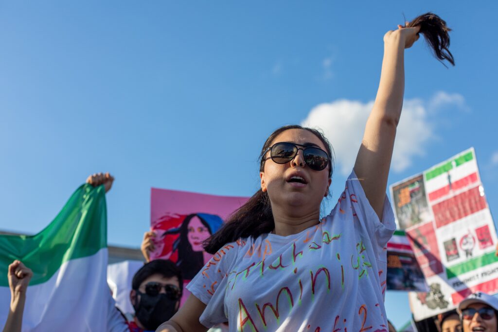 A protest in response to the death in detention of Mahsa Amini by Iran's morality police in Tehran (Image: Tolga Ildun/ Shutterstock)