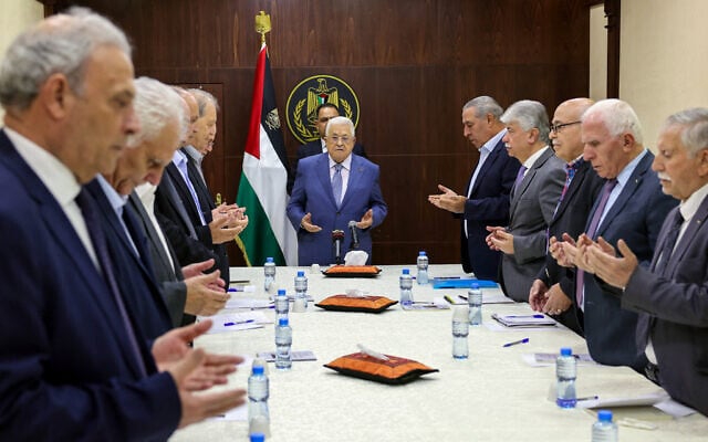 Palestinian Authority President Mahmoud Abbas (C) recites a prayer during a meeting with members of the executive committee of the Palestine Liberation Organisation (PLO) in the West Bank city of Ramallah (Image: WFA/ X)