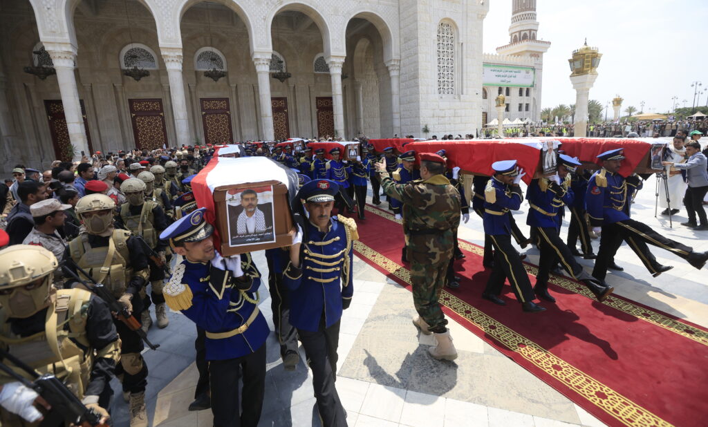 Honour guard carry the coffins of senior Houthi officials who were killed in recent Israeli strikes, during a funeral in Sana'a, Yemen, September 1, 2025 (Image: EPA/Yahya Arhab)