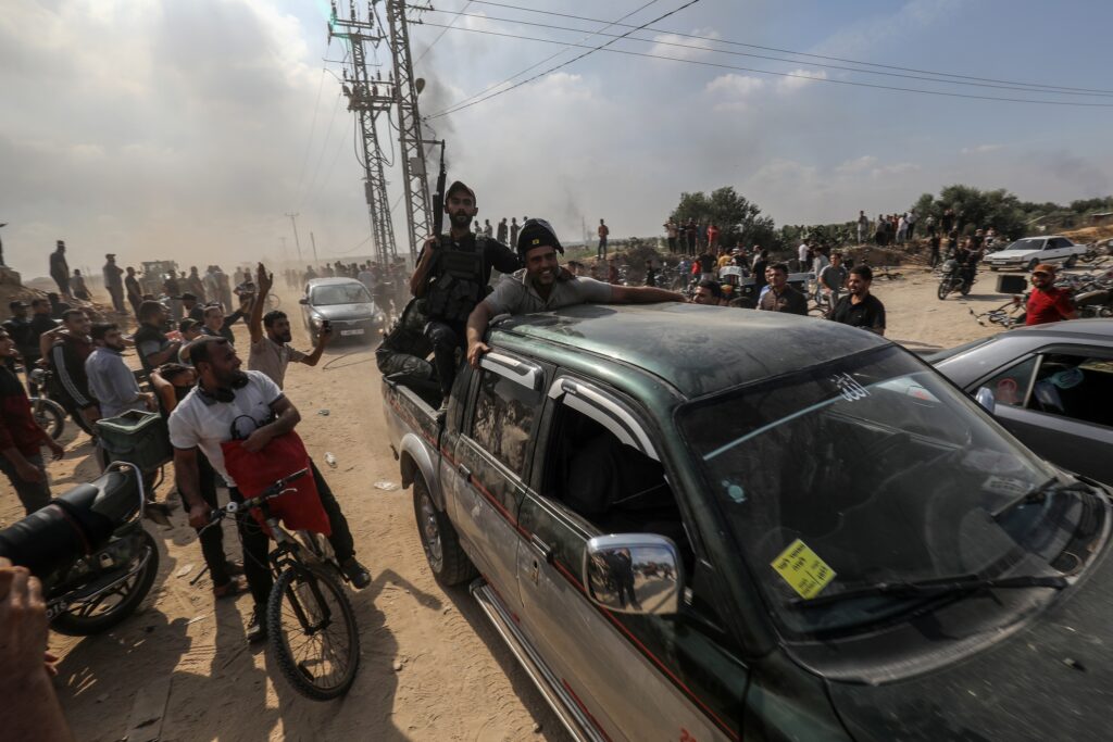 Palestinians storm across the Gaza border, 7 October 2023 (Image: Shutterstock)