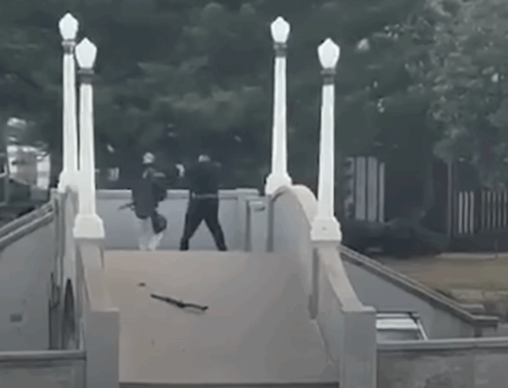 Bondi terrorists Sajid and Naveed Akram open fire at Jews attending Chanukah by the Sea 2025 (Image: Screenshot)