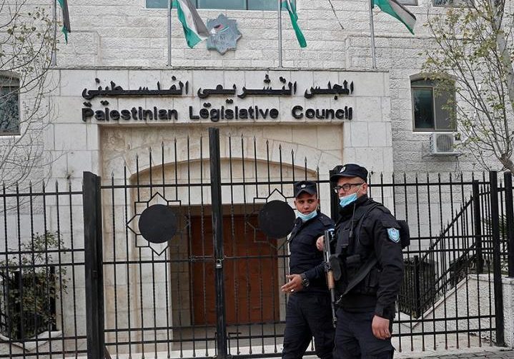 Palestinian police patrol outside the Palestinian Legislative Council chambers in Ramallah, a body which was last elected in 2006, and which has effectively been non-functional since 2007