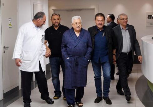 Abbas in hospital, flanked by his two sons (image via Facebook)