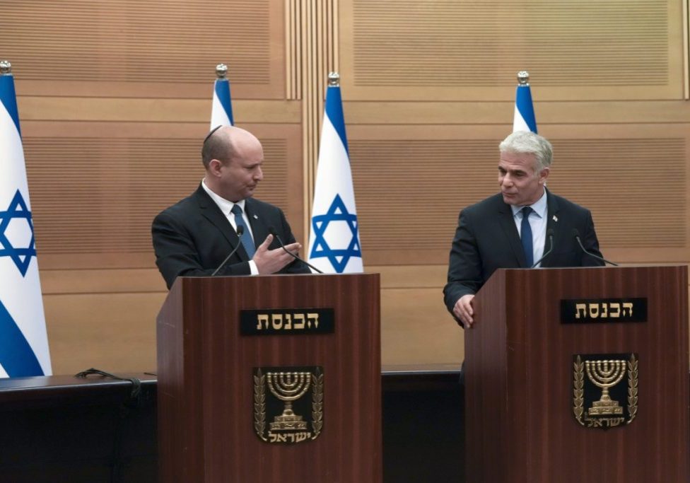 Israeli Prime Minister Naftali Bennett, left, speaks during a joint statement with Foreign Minister Yair Lapid, at the Knesset, Israel's parliament, in Jerusalem, Monday, June 20, 2022.  (AP Photo/Maya Alleruzzo)