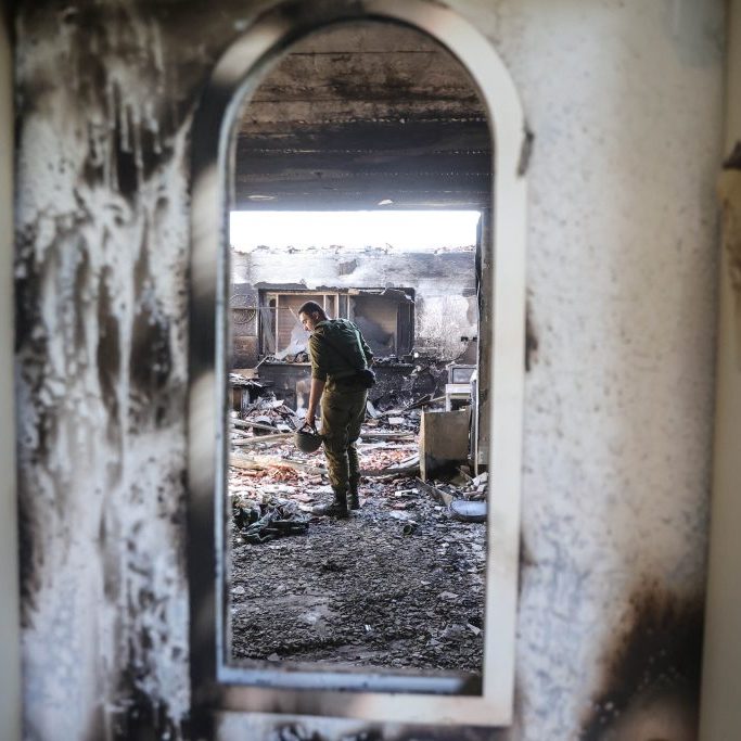 An Israeli soldier inside the rubble of a house in Kibbutz Be’eri, near the border with Gaza, where at least 130 Kibbutz members were killed by Hamas in its attack against Israel from the Gaza Strip on October 7. (Image: AAP/ Abir Sultan)