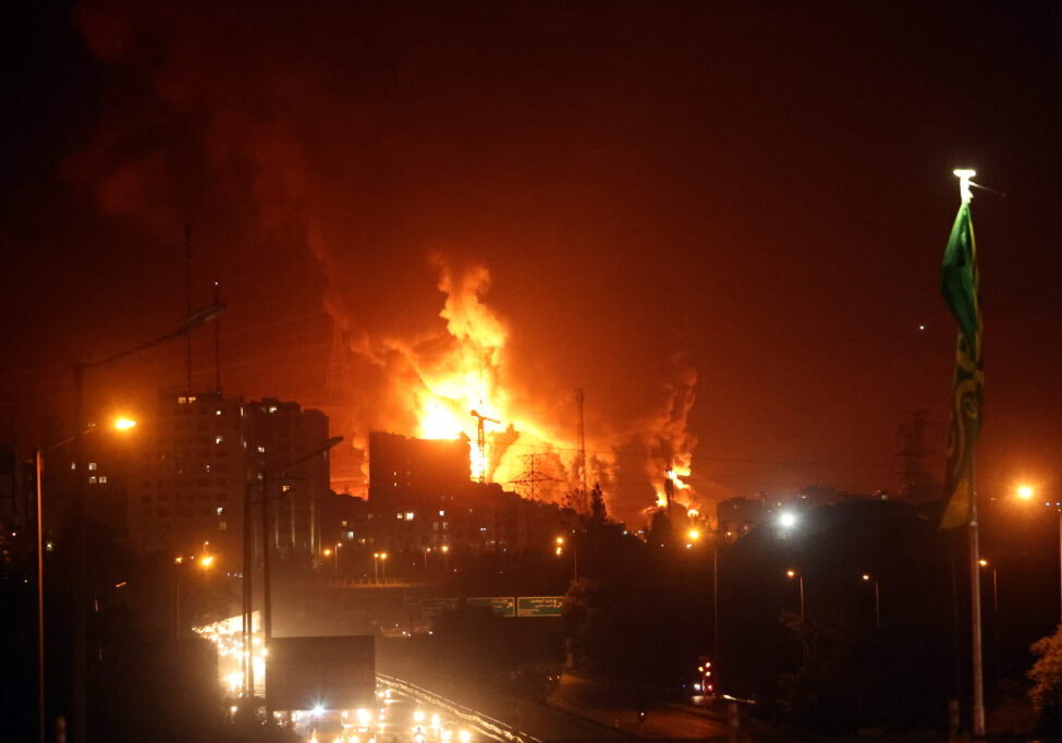 Fire and smoke rise from an oil warehouse in Teheran, Iran, June 15, 2025 (Image: EPA/ Abedin Taherkenareh)