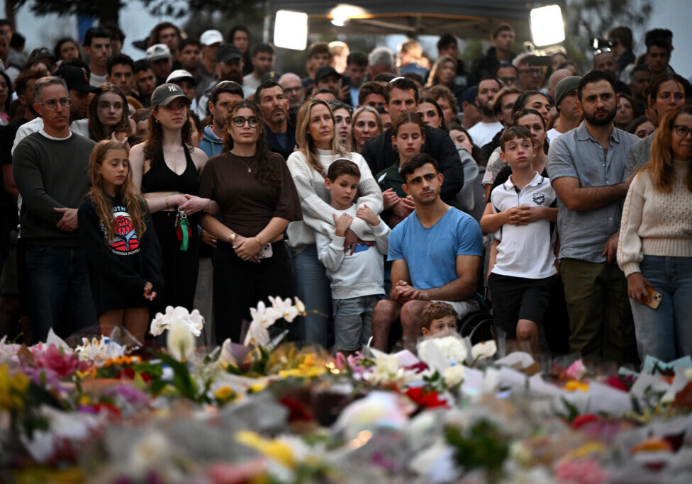 Mourners attend a vigil at a memorial in Bondi Beach in Sydney, December 15, 2025, after gunmen opened fire on Bondi Beach, killing 15 people in an attack targeting the Jewish community (Image: AAP Image/ Bianca De Marchi) 