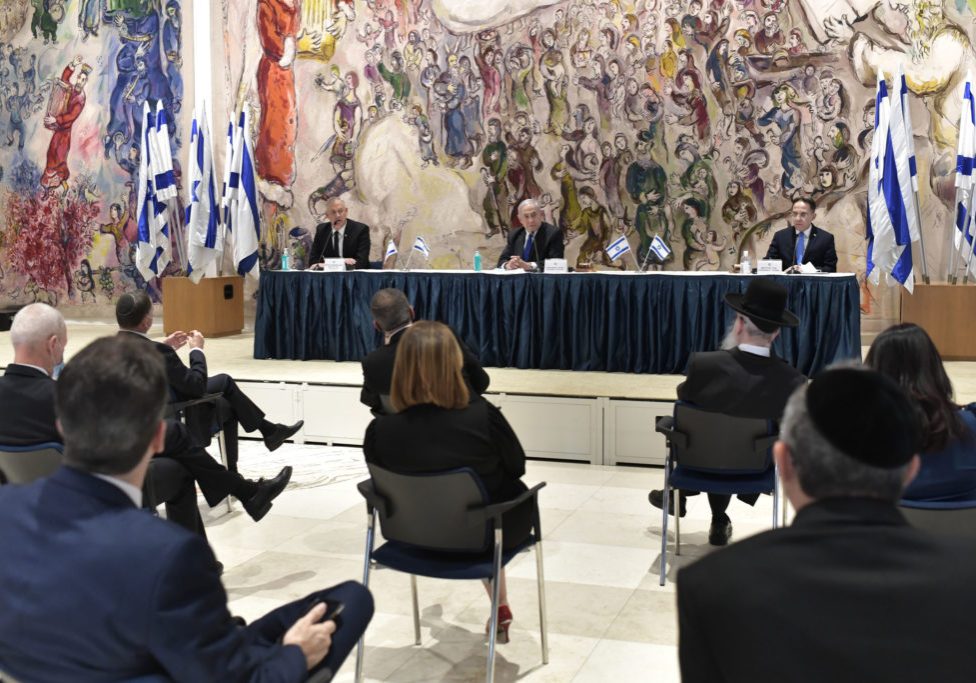 Israel’s new 35 minister cabinet meeting for the first time while social distancing