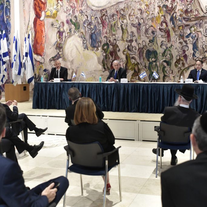 Israel’s new 35 minister cabinet meeting for the first time while social distancing