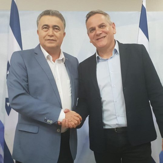 Labor leader Amir Peretz and Meretz Leader Nitzan Horowitz celebrate their election pact.