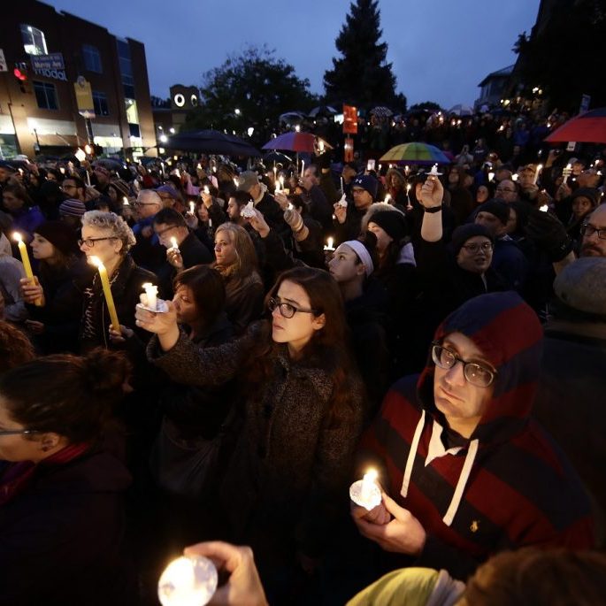 People hold candles as they gather for a vigil in the aftermath of a deadly shooting at the Tree of Life Congregation, in the Squirrel Hill neighborhood of Pittsburgh, Saturday, Oct. 27, 2018. (AP Photo/Matt Rourke)