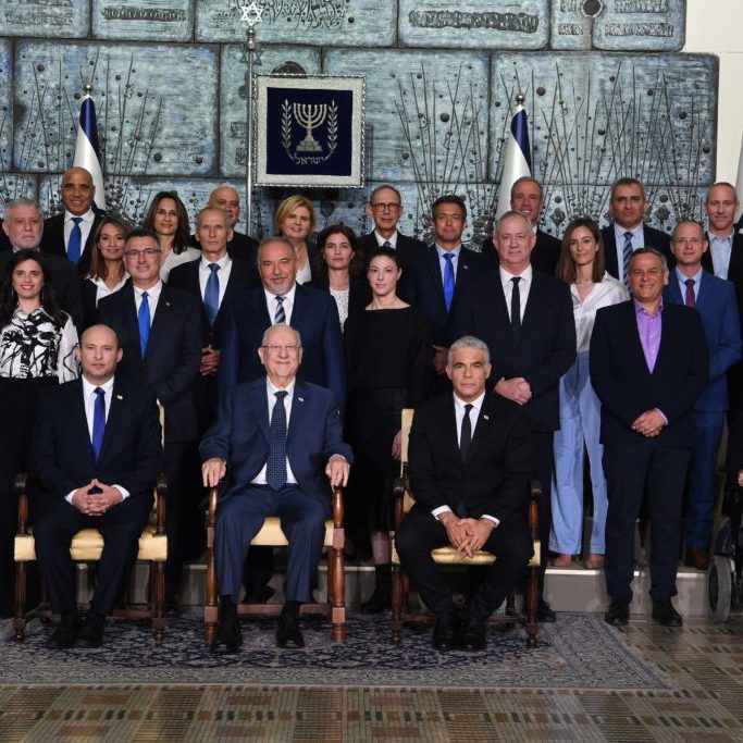 Members of Israel’s new ministry led by Prime Minister Naftali Bennett sit with President Reuven Rivlin in Jerusalem (Source: Israeli Government Press Office/ Flickr)