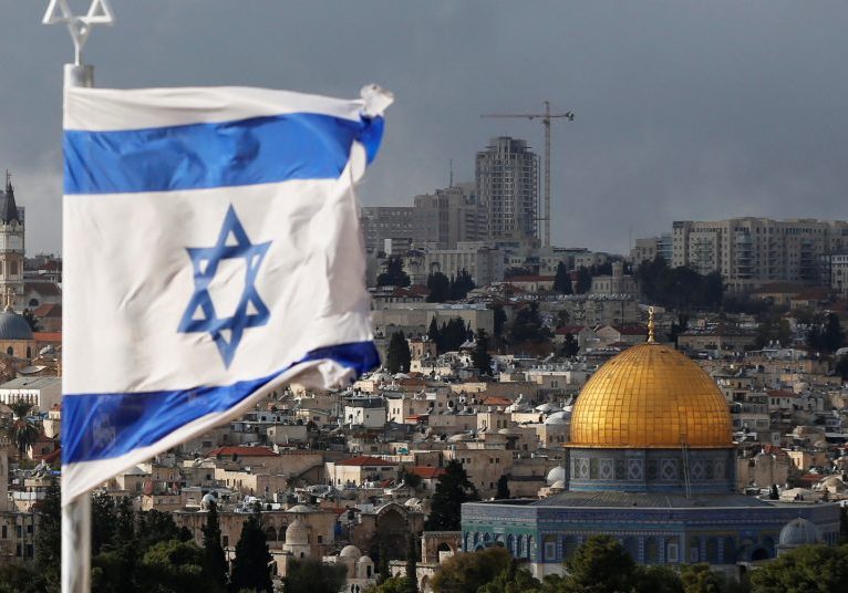 An Israeli Flag Is Seen Near The Dome Of The Rock, Located In Jerusalem's Old City On The Compound Known To Muslims As Noble Sanctuary And To Jews As Temple Mount