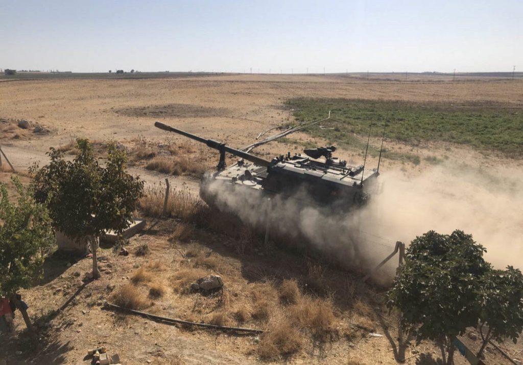 Turkey invades Syria: Turkish Armed Forces' howitzers deploy across the border near the  Kurdish-held Syrian town of Tell Abyad (Image: GETTY). 