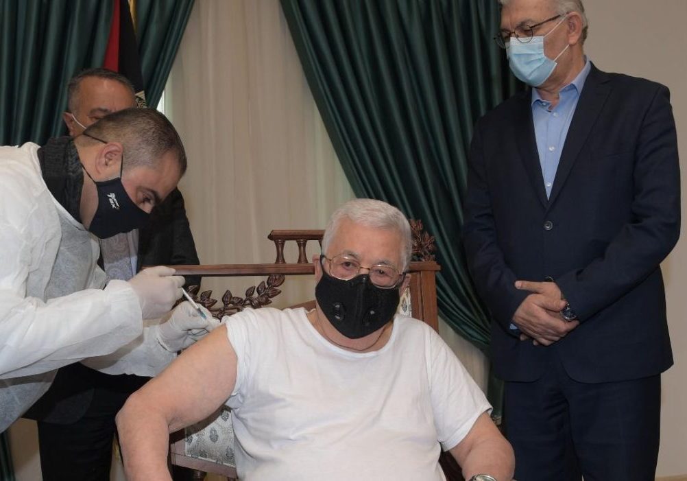 Palestinian Authority President Mahmoud Abbas receives his first shot of COVID-19 vaccine, March 20, 2021. (Screenshot/WAFA)