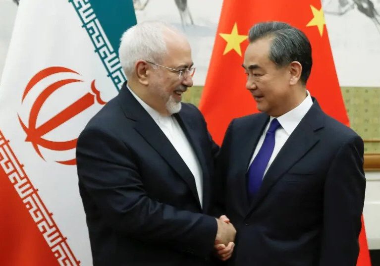 Chinese State Councillor and Foreign Minister Wang Yi meets Iranian Foreign Minister Mohammad Javad Zarif at Diaoyutai state guesthouse in Beijing, China May 13, 2018 (photo credit: THOMAS PETER/REUTERS).