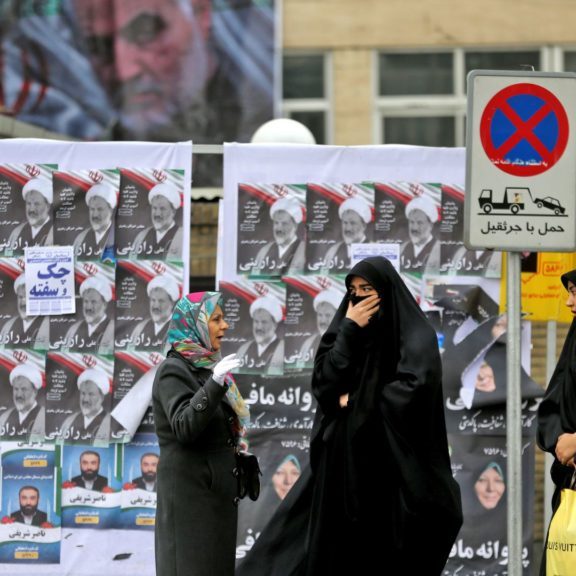 Electoral posters and a banner featuring Qasem Soleimani in Tehran. Photo: Atta Kenare/AFP via Getty Images