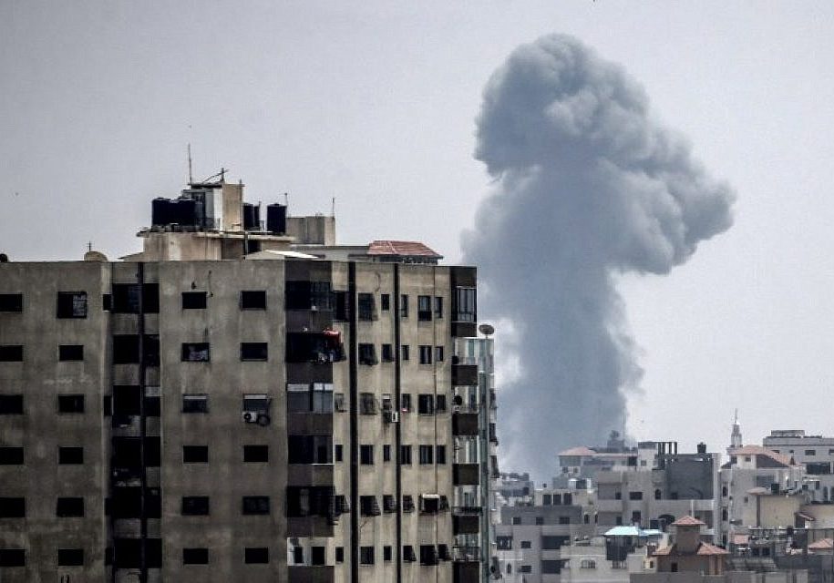 A picture taken on July 14, 2018, shows a smoke plume rising following an Israeli air strike in Gaza City (AFP PHOTO / MAHMUD HAMS)