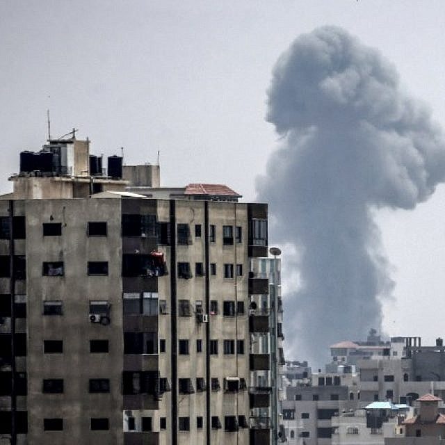 A picture taken on July 14, 2018, shows a smoke plume rising following an Israeli air strike in Gaza City (AFP PHOTO / MAHMUD HAMS)