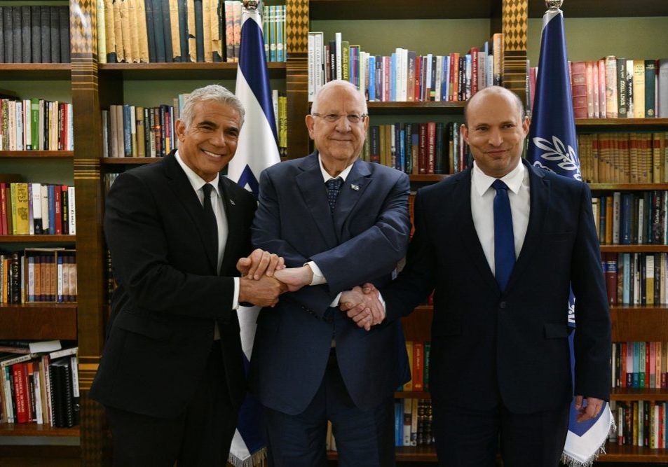 Naftali Bennett (R), Yair Lapid (L) and former Israeli President Reuven Rivlin (credit:Haim Tzach / GPO)