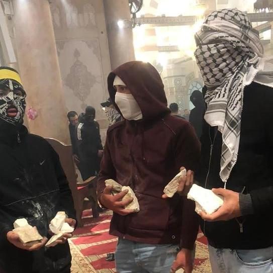 Palestinian extremists ready stones inside the Al-Aqsa Mosque on April 15. Source: Twitter