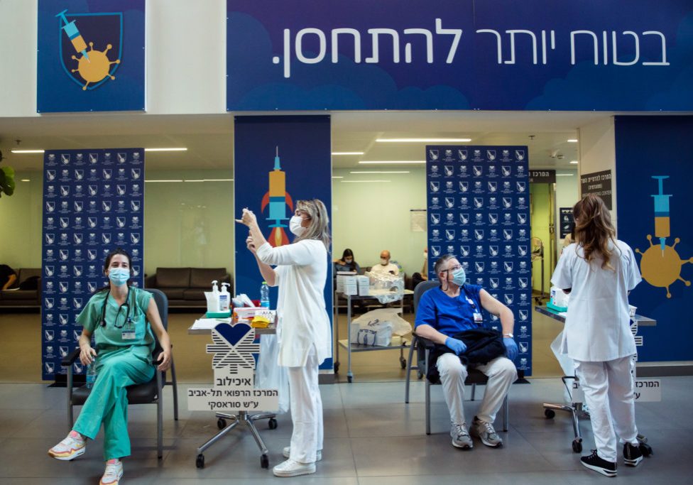 Medical workers vaccinate medical stuff members against Coronavirus disease(COVID-19) at Tel Aviv Sourasky Medical Center (Photo by Amir Levy/Getty Images)
