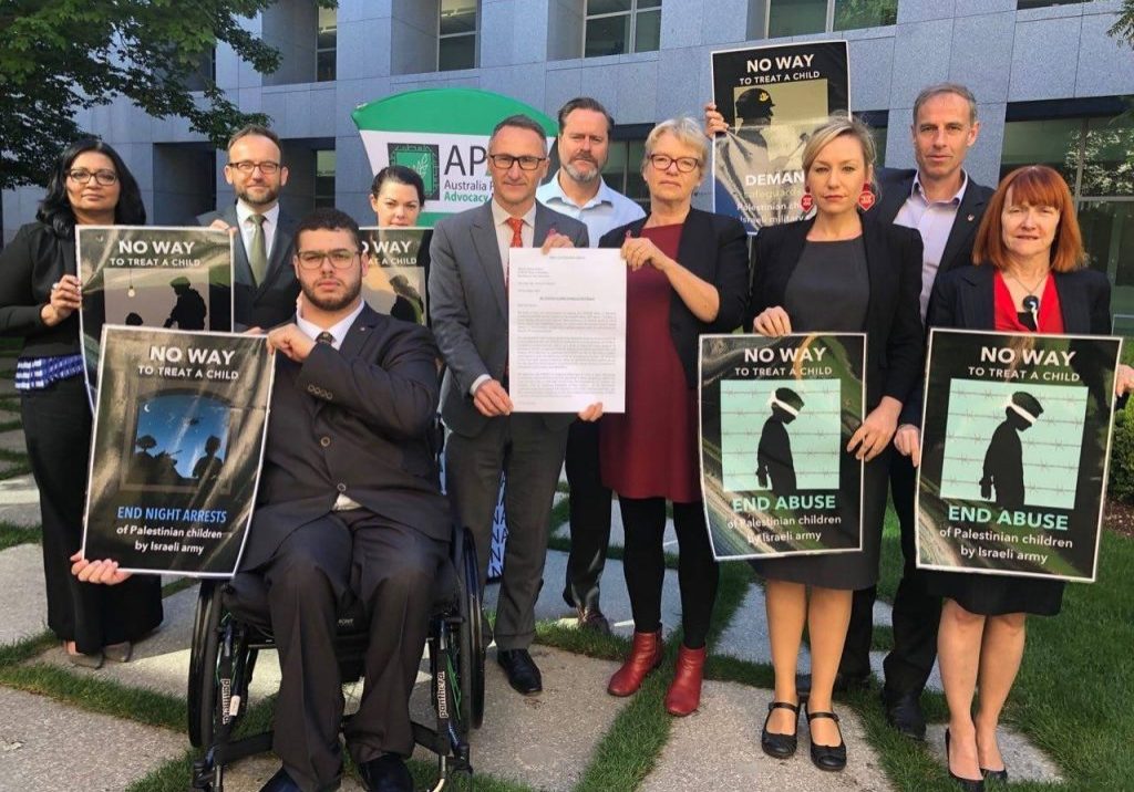 Then Greens leader Richard di Natale joining with the Australia Palestine Advocacy Network (APAN) on a petition regarding children in detention in 2018 (Image: Facebook)