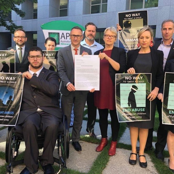 Then Greens leader Richard di Natale joining with the Australia Palestine Advocacy Network (APAN) on a petition regarding children in detention in 2018 (Image: Facebook)