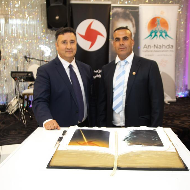 Then-NSW MP Shaoquett Moselmane (left) at the 2022 SSNP annual meeting (Image: Syrian SSNP official website)