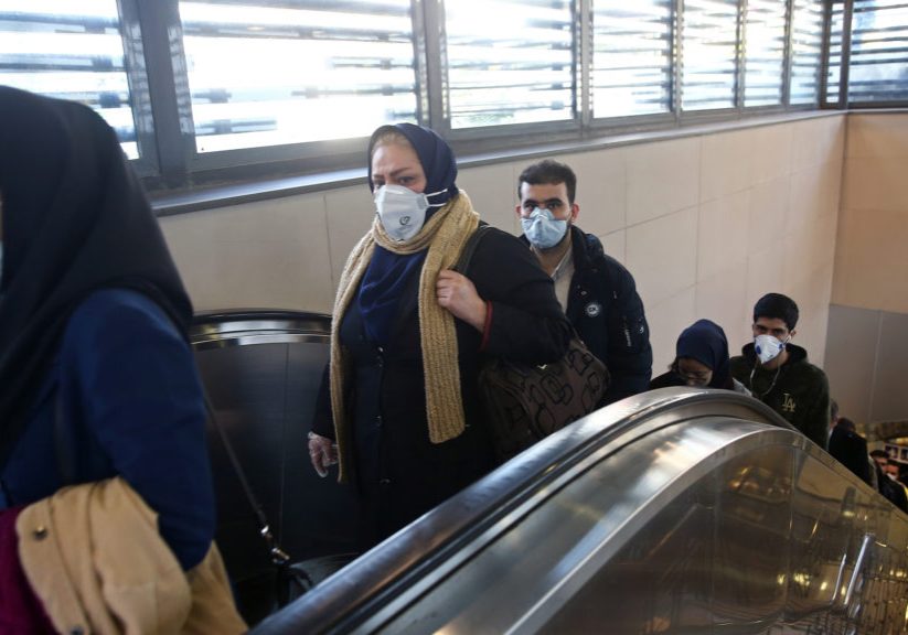 Iranian people wear protective masks to prevent contracting a coronavirus, as they climb an escalator in Teheran. Photo: WANA (West Asia News Agency)/Nazanin Tabatabaee via REUTERS