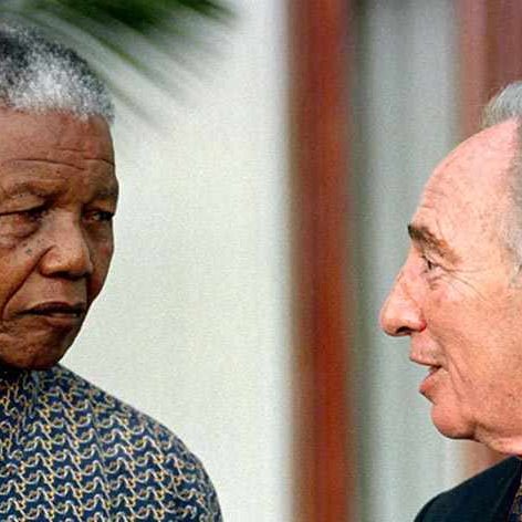Nelson Mandela with Shimon Peres in 1999