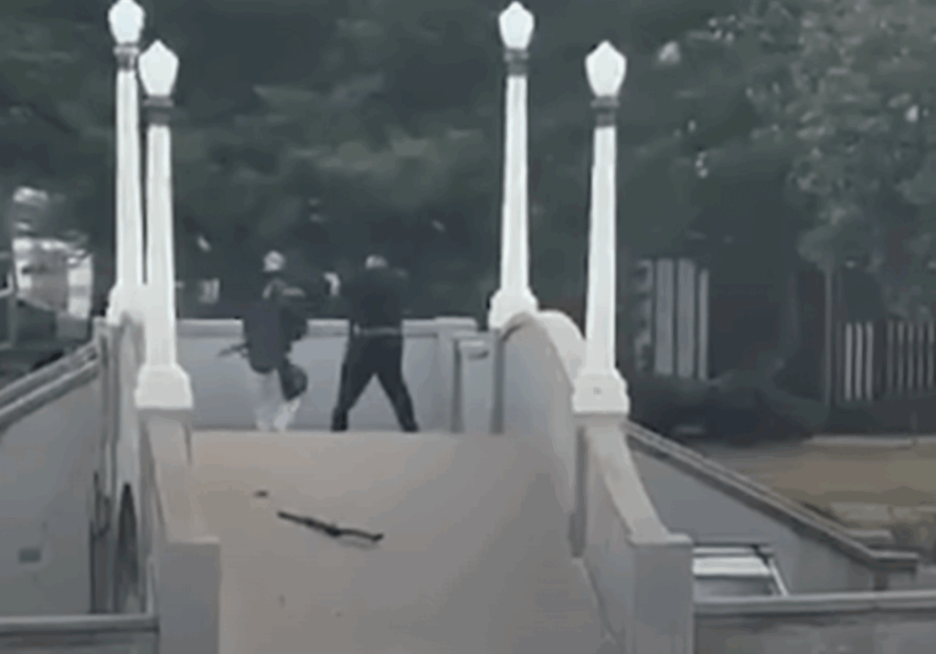 Bondi terrorists Sajid and Naveed Akram open fire at Jews attending Chanukah by the Sea 2025 (Image: Screenshot)