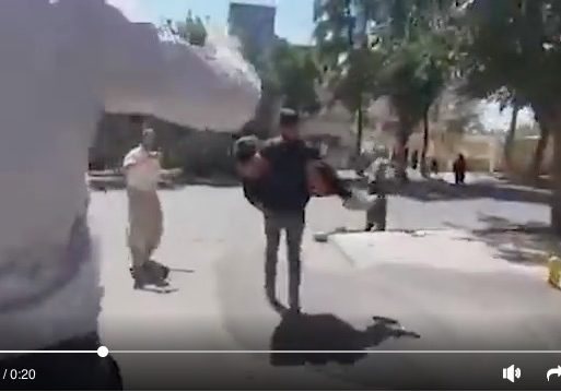 A screenshot from a video posted on Sept. 17 shows an injured protester in Saqqez, Iran, being rushed to a medical facility. (Video: Twitter)