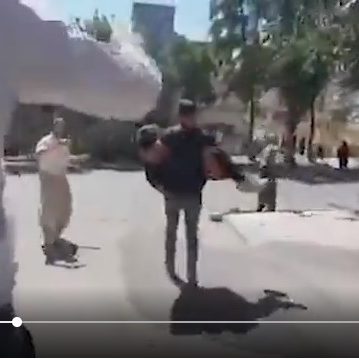 A screenshot from a video posted on Sept. 17 shows an injured protester in Saqqez, Iran, being rushed to a medical facility. (Video: Twitter)