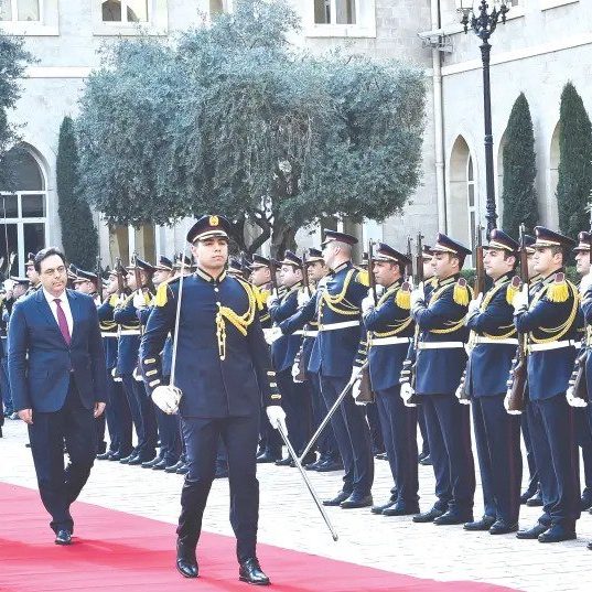 Lebanon's new PM Hassan Diab reviews an honour guard at the government palace in Beirut earlier this week (photo credit: REUTERS)