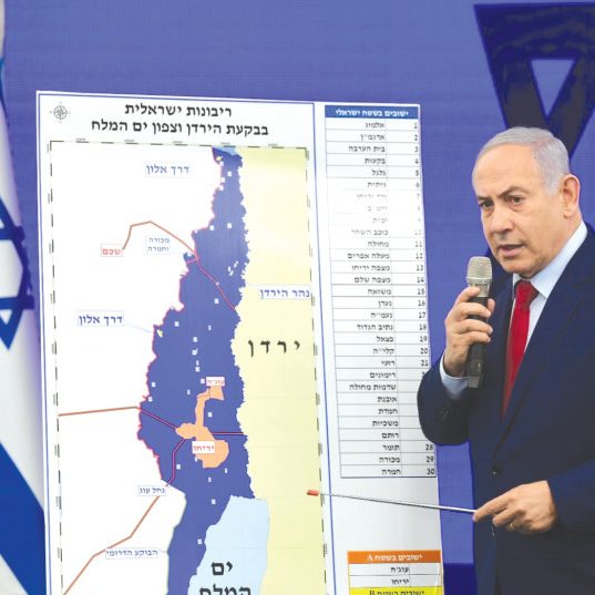 Israeli PM Binyamin Netanyahu presents a map of the Jordan Valley area to which he proposes to extend Israeli sovereignty