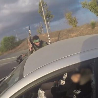 Screenshot of Hamas bodycam footage as terrorists approach an Israeli vehicle during the terror organisation's October 7, 2023 attack in southern Israel, released by the IDF and GPO (Screenshot)